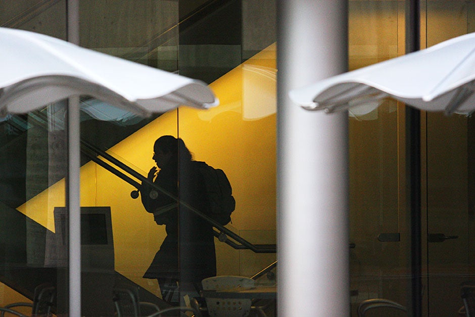 Moving shadows: A figure heads upstairs at Bauer Lab. Kris Snibbe/Harvard Staff Photographer