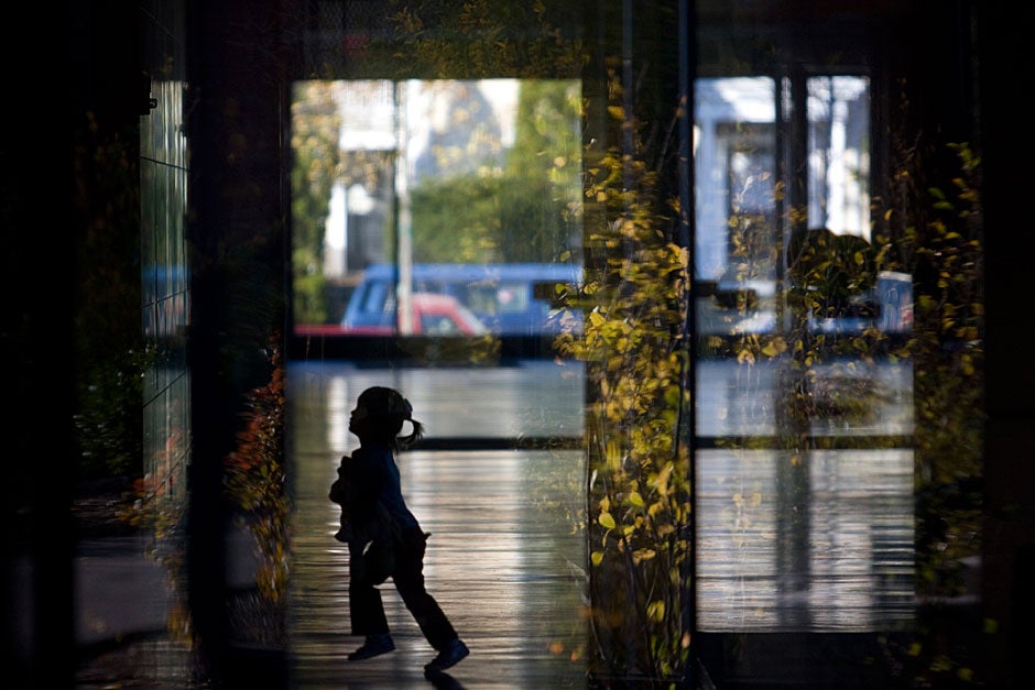 A toddler prances through the Northwest Science Building. Kris Snibbe/Harvard Staff Photographer