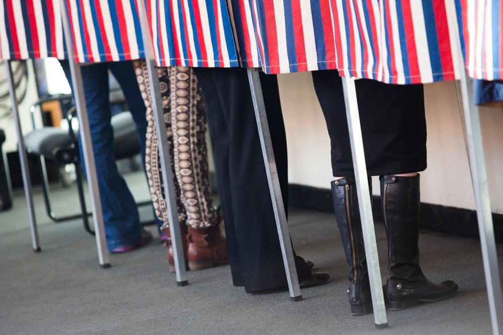Voters cast their ballots in the Gund Hall polling location at Harvard Graduate School of Design at Harvard University. Stephanie Mitchell/Harvard Staff Photographer