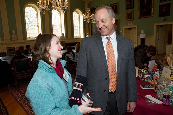 "Once I start thinking of all the people who deserve my gratitude, I realize that I have a lot of notes to write," said FAS Dean Michael D. Smith (right), who chatted with student volunteer Mackenzie Hild '14 in University Hall.