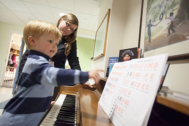 After moving from Wisconsin, Tessa Lowinske Desmond and her husband, Matthew, used the WATCH Portal to help them find child care for their son Sterling. Having easy access to baby sitters who lived on campus was crucial, Desmond said, as she watched Sterling play the piano at the Radcliffe Child Care Center.
