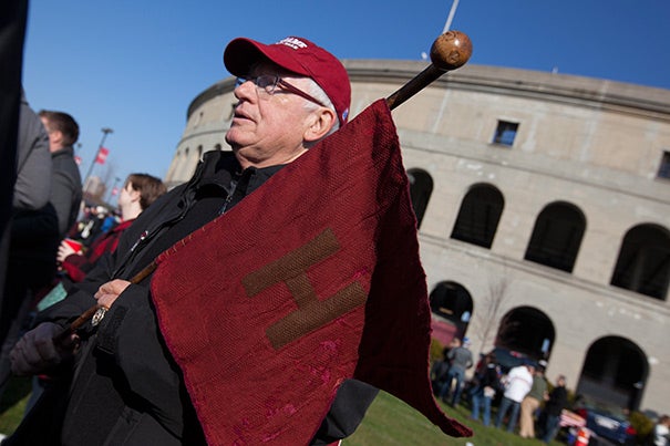 Bill Markus ’60 strolled proudly through the tailgating party with the Little Red Flag of 1884. 