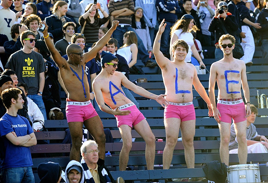 Yale students prove that real men aren't afraid to wear pink at The Game in 2009. Outlandish behavior and pranks such as stealing school colors from the opposing side are part and parcel of the H-Y tradition.