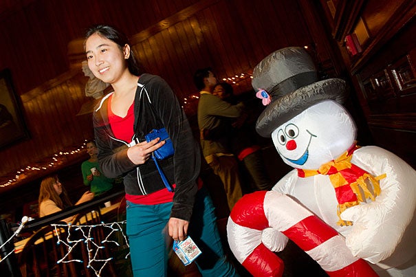 Joanna Wang '16 is in good spirits as she walks into Annenberg Hall  past Frosty the Snowman. Wang joined other freshmen for Winter Fest, a low-key event planned by the First-Year Social Committee.