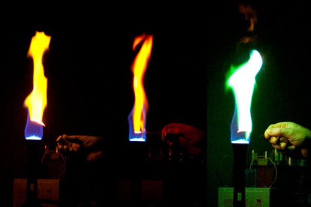 In a series of demonstrations at the SEAS Holiday Lecture, Daniel Rosenberg held filaments of calcium, lithium, and copper in the flame of a Bunsen burner, producing flashes of orange, red, and green.