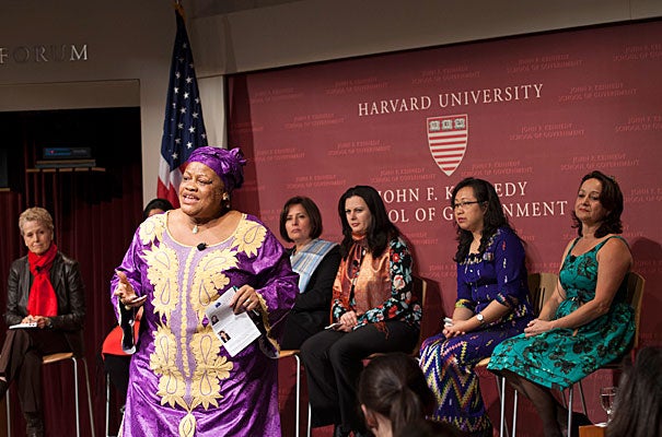 After “the women of Liberia got to the [negotiating] table, we’ve had 10 years of peace," Julia Duncan-Cassell (standing), Liberia’s minister of gender and development, told a Harvard Kennedy School audience. Among the panelists were moderator Swanee Hunt (from far left), Sabrina Saqeb (not seen), Wafa Bugaighis, Rajaa Altalli, Ja Nan Lahtaw, and Sofi Ospina.