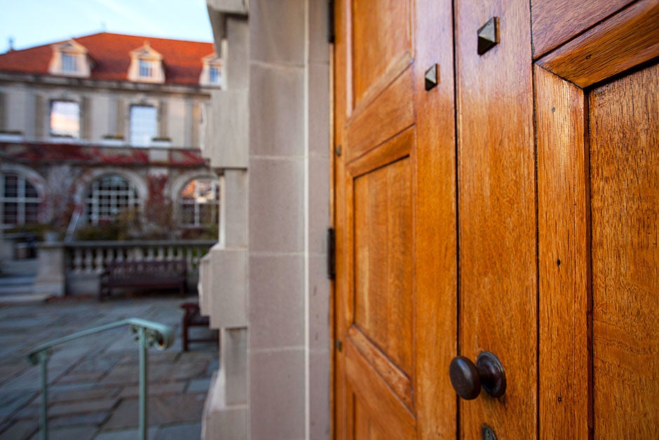 Large oak doors face the courtyard. Busch Hall was built in the spirit of a grand medieval hall and is home to German medieval plaster casts, mostly from churches, as well as the famous Flentrop organ, used for a popular Harvard concert series. Rose Lincoln/Harvard Staff Photographer