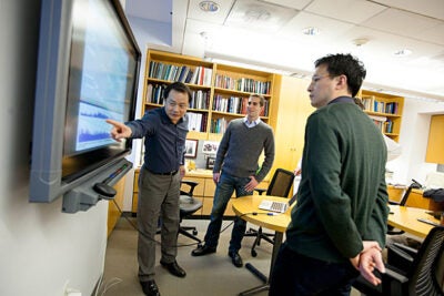 Mallinckrodt Professor of Chemistry and Chemical Biology Xiaoliang Sunney Xie (from left) has co-authored a paper on gene sequencing with graduate student Alec Chapman and postdoctoral fellow Chenghang Zong. The paper demonstrates a new method for DNA amplification that could signal a breakthrough in genomics. 