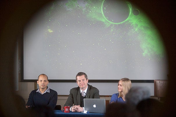 “The nearest Earth-like planet is probably 13 light-years away; astronomically speaking, that’s just a stroll across the park,” said Courtney Dressing (right), a doctoral student in Harvard’s Astronomy Department. At the press conference Dressing was joined by Professor David Charbonneau  (center) and John Johnson, an assistant professor of astronomy at the California Institute of Technology.