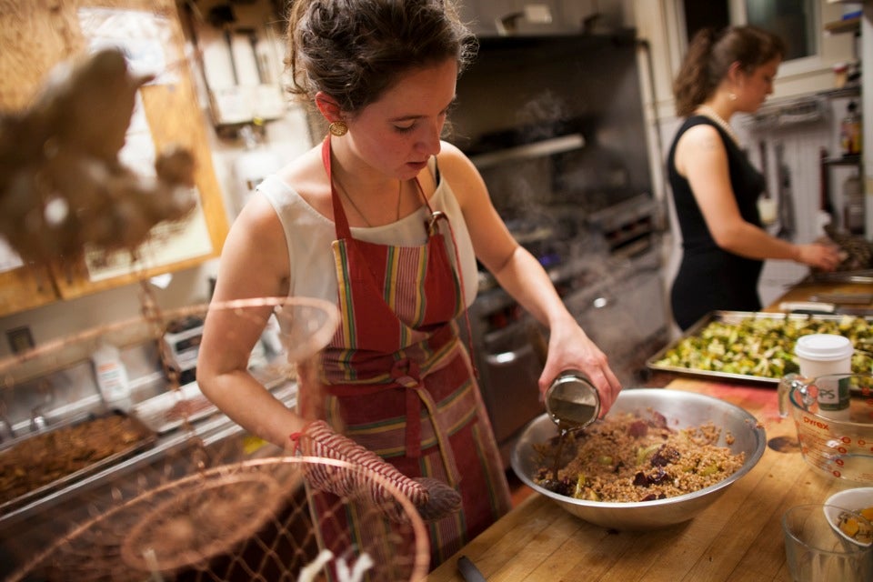 Zoe Tucker '13 (left) and Charlotte Lieberman '13 prepare farro, a grain, with roasted beets and apples and broccoli roasted with honey, lemon, and cayenne.