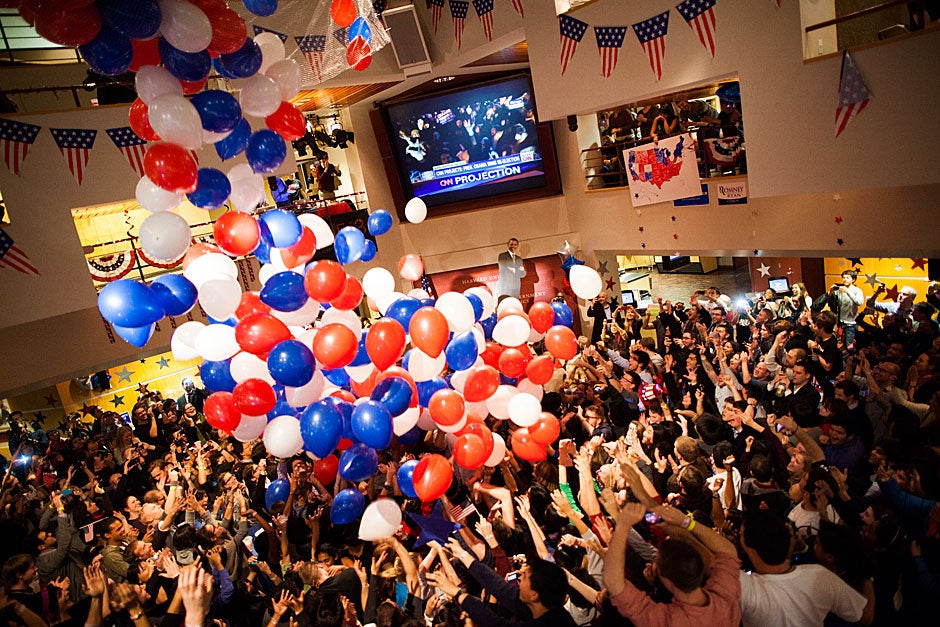 Students, faculty, and community members gathered at the Forum to watch coverage of the 2012 election. Balloons fell on the crowd when the presidential winner was announced. Stephanie Mitchell/Harvard Staff Photographer