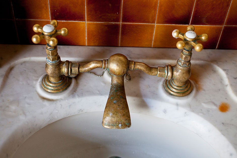 The marble basin and faucets are presumed original. 
