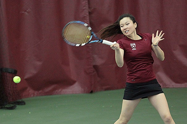 Hideko Tachibana '13 hits a hard forehand during her doubles match with partner Hannah Morrill '14.
