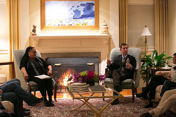 Professor Matthew Nock (right), Harvard College Dean Evelynn M. Hammonds, and 20 students gathered at Hammonds' home for a fireside chat. The event was the second in a new series meant to connect undergraduates with faculty members in an open, informal, and welcoming atmosphere. 

