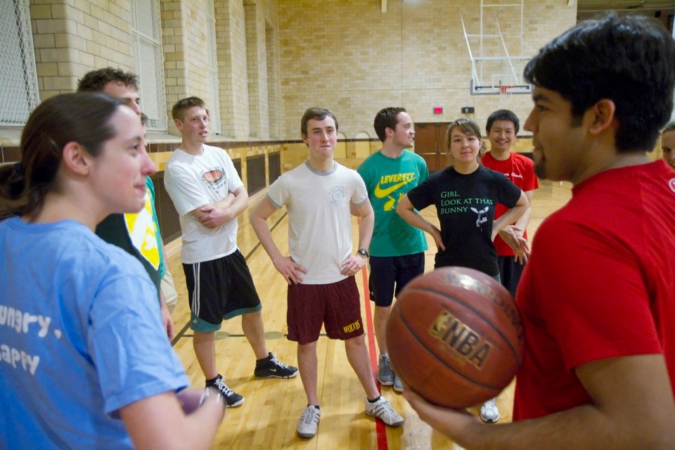 Leverett House basketball Team C members choose sides for an intrasquad game after another House failed to show up for their scheduled contest.