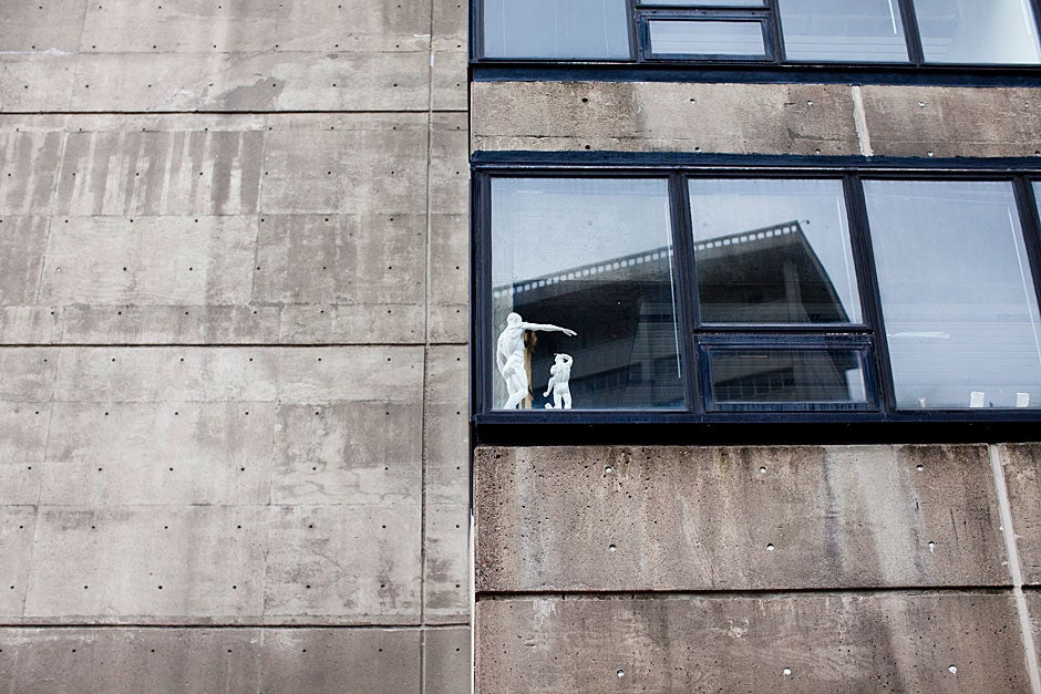 Human forms, a model of the golden ratio, reside in the window of Gund Hall at the Harvard Graduate School of Design. 