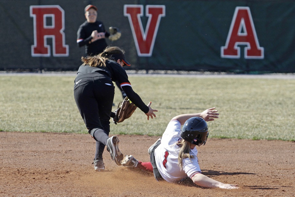 Stephanie Regan ’13 slides safely beneath the tag at second base. Regan was 3-for-6 with four runs for the day.