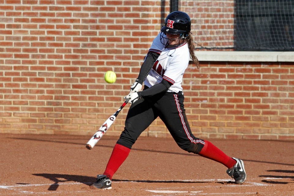 Kasey Lange ’14 connects. Lange had two hits and knocked in three RBIs.