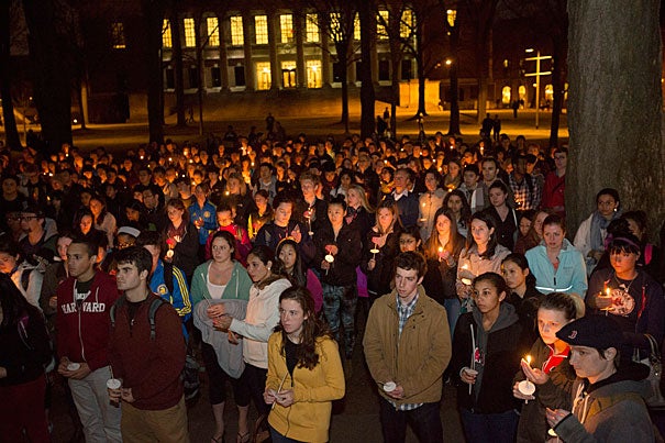 People gather for a candle light vigil at The Memorial Church at Harvard University in the wake of the violence visited upon the city of Boston yesterday during the Boston Marathon. Photo by Kris Snibbe/Harvard Staff Photographer