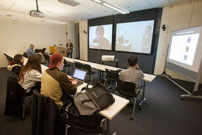 Guest lecturer Sarah Kocher used the built-in cameras and three large screens in the Northwest Lab classroom for a videoconference. Other institutions’ students joined the Harvard class remotely, creating a single virtual classroom. The class is part of a five-year initiative whose goal is to increase the use of museum collections in teaching. 

