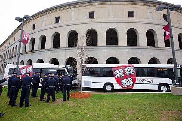 Members of the Harvard University Police Department gathered at Harvard Stadium to take shuttle buses to the memorial service for Sean Collier, the MIT police officer killed last week.