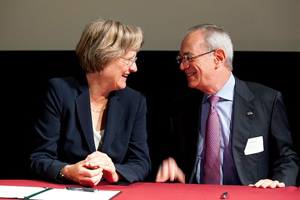 “Harvard is honored to be among the first signatories of the Community Compact,” said President Drew Faust (left). “We have much to gain from continuing to work together to confront climate change." MIT President L. Rafael Reif (right) joined Faust, Cambridge Mayor Henrietta Davis, and City Manager Robert Healy in the “Community Compact for a Sustainable Future” signing ceremony.