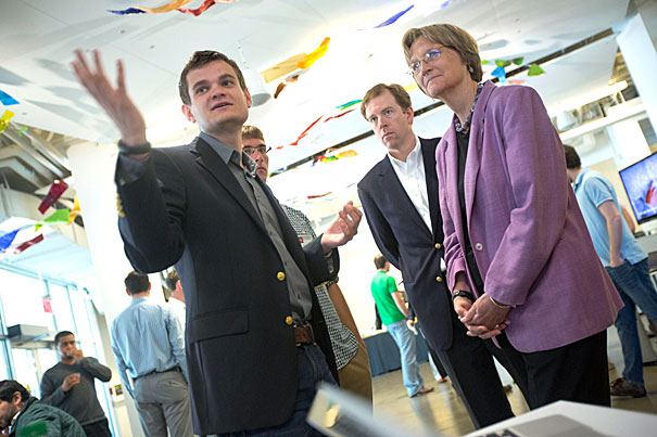 Scott Crouch '13 (from left) and Florian Mayr '13 discuss their project, Nucleik, with i-lab Managing Director Gordon Jones and President Drew Faust. 