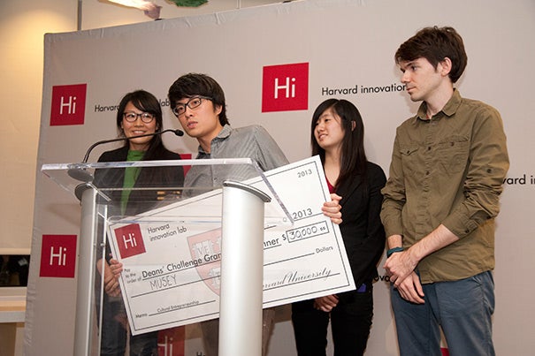 Hokan Wong (at podium) addressed the audience on behalf of the winning team:  Judy Fulton (from left), Wong, Lucy Cheng '17, and Wes Thomas. The group developed an online platform called Musey. Musey helps people find art performances in their vicinity. Their vision is what captivated the judges and landed the team $30,000 and the grand prize in the Deans’ Cultural Entrepreneurship Challenge.