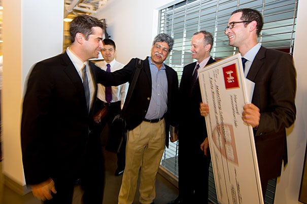 Derek DiRocco (left) and Rafael Kramann (far right) are congratulated after their team, MatriTarg Laboratories, won the Deans' Health and Life Sciences Challenge, collecting a $40,000 grand prize. “The help the i-lab has provided has really been invaluable,” DiRocco, a research fellow at Harvard Medical School and Brigham and Women’s Hospital, said. “It was very helpful to have assistance in growing our company and our ideas.”
