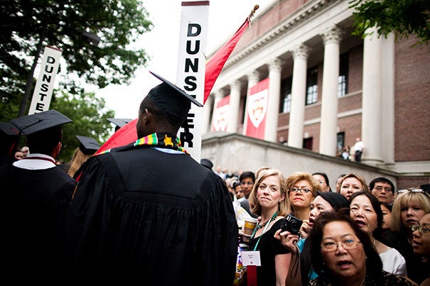 The Morning Exercises take place in Tercentenary Theatre. Family members watch graduates process in front of the steps of Widener Library during the Commencement ceremony of 2010. Photo by Stephanie Mitchell/Harvard Staff Photographer