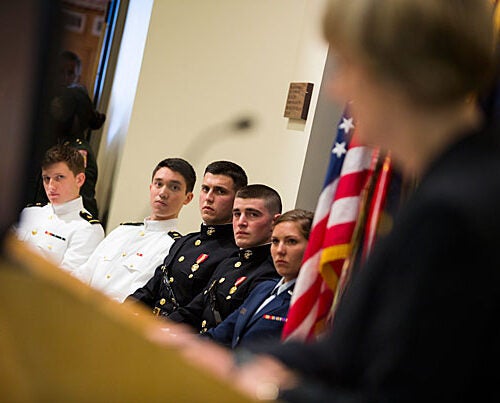 Colin Dickinson (from left), Christian Yoo, Gavin Pascarella, Brian Furey, and Courtney Diekema listened as President Drew Faust praised the students for their dedication and commitment to serve in the military.