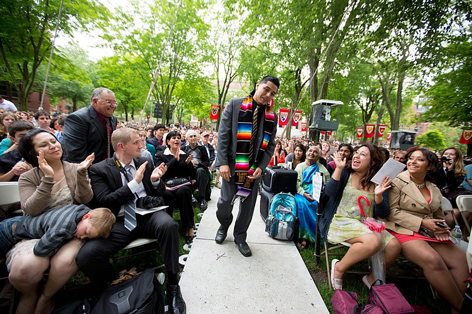 Victor Flores Jr. walks to accept the Ames Award during Class Day festivities. The Ames Award honors an unsung hero of the graduating class. Rose Lincoln/Harvard Staff Photographer