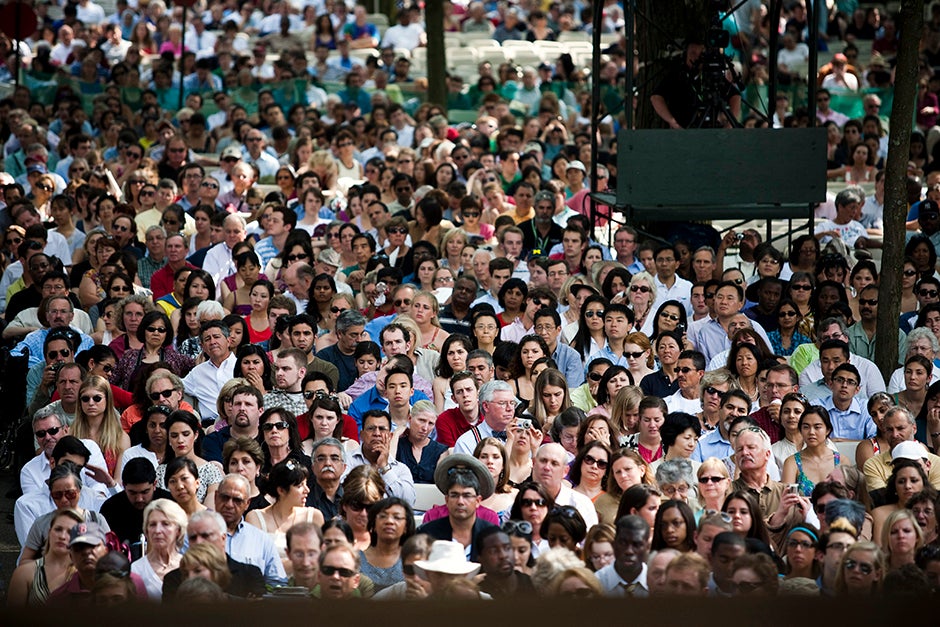 Harvard University's Senior Class Day Exercises take place in Tercentenary Theatre. Christiane Amanpour, CNN's Chief International Correspondent, is the featured speaker. The crowd of gathered seniors and their families listens to the speakers. Stephanie Mitchell/Harvard Staff Photographer