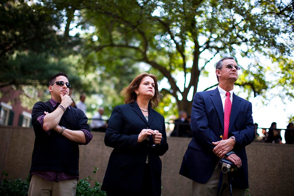 Jason Aaron Katz (from left), Rebecca Hart, and Ricky Hart watch the Morning Exercises in 2010. Stephanie Mitchell/Harvard Staff Photographer