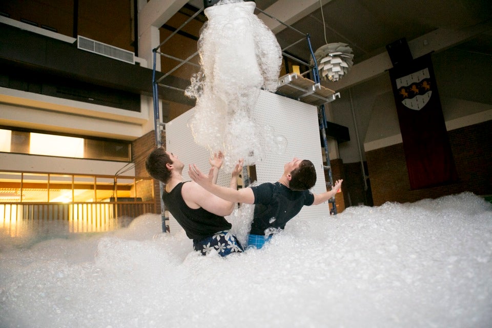 You can’t put your arms around foam, but Torin Zonfrelli ’16 (left) and Edward Caputo ’16 try.
