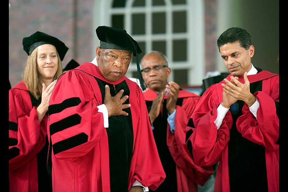 Honorand John Lewis replied to his standing ovation by placing his hand on his heart. Jon Chase/Harvard Staff Photographer