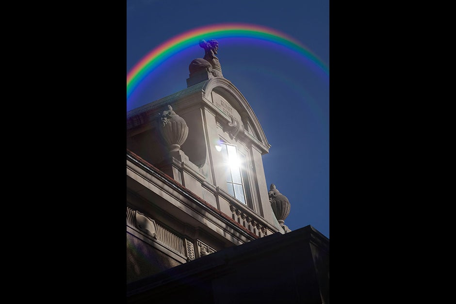 This rainbow, caused by a camera lens flare, arcs above the Minda de Gunzburg Center for European Studies. Kris Snibbe/Harvard Staff Photographer

