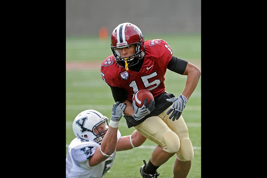 Crimson wide receiver Levi Richards '11 tries to break away from Yale defensive back Paul Rice during the 125th playing of the Harvard-Yale game in 2008. Harvard won, 10-0, and shared the Ivy League championship with Brown.