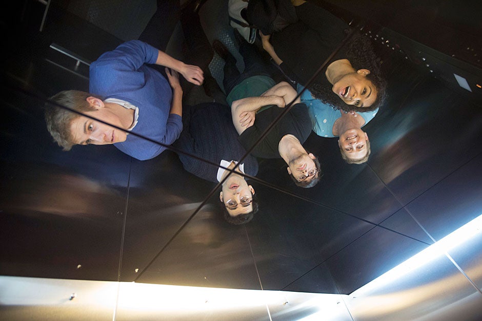 Rhodes Scholars from Quincy House, Benjamin B.H. Wilcox ’13 (from left), Julian B. Gewirtz ’13, Aidan C. de B. Daly ’13, House Co-Master Deb Gehrke, and Nina M. Yancy ’13 are pictured reflected in the House elevator ceiling on their way up to the sixth floor, where the students all resided. Kris Snibbe/Harvard Staff Photographer