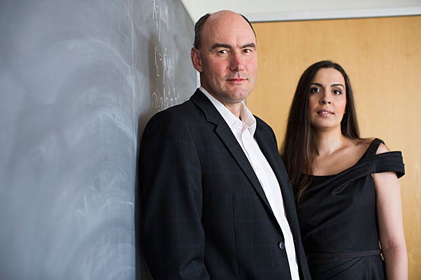 Harvard Professor Martin Nowak (left) and Ivana Bozic, a postdoctoral fellow in mathematics, are the co-authors of a recent paper that lays out a possible method for curing cancer. Their research shows that using two drugs, in certain circumstances, could eliminate the disease. 