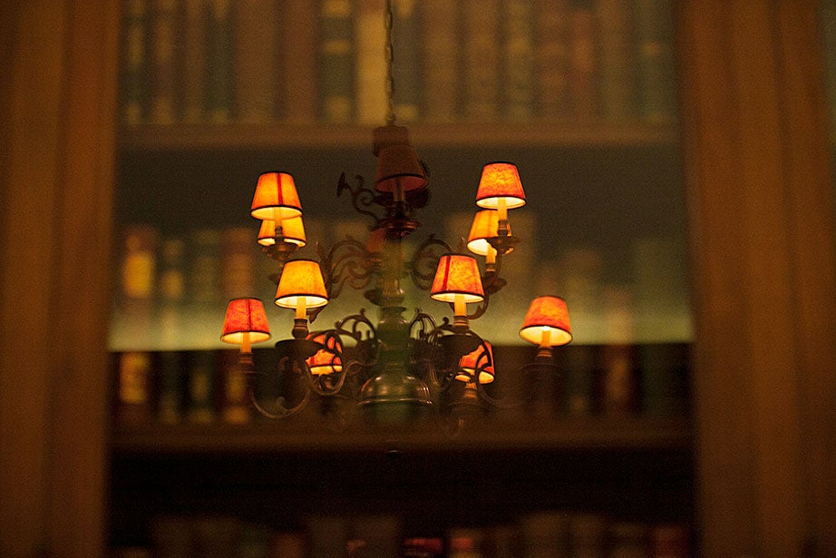 Lights reflect off the glass cases in the Keats Room.