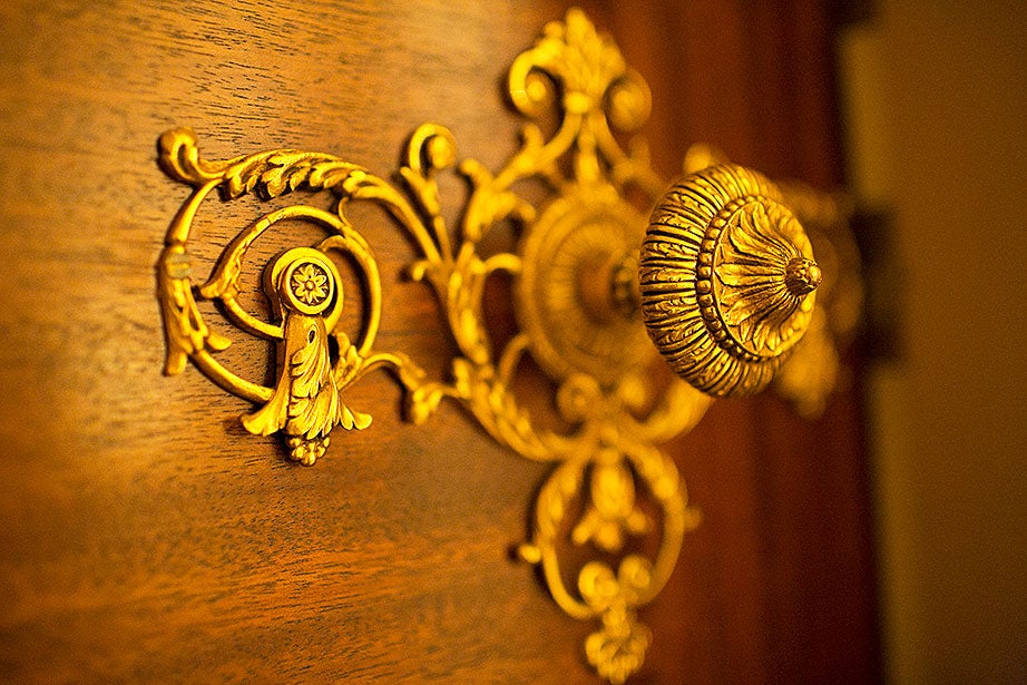 A doorknob in the Hyde Room glistens in the subdued light.