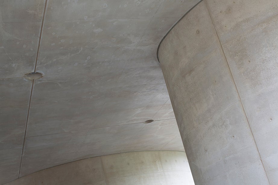 Concrete pillars shape a covered pathway under the Laboratory for Integrated Science and Engineering.