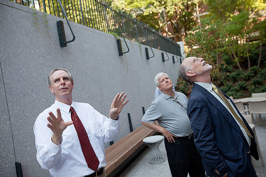 Architect Stephen Kieran from the firm KieranTimberlake, Quincy House Master Lee Gehrke, and Harvard College interim Dean Donald Pfister are seen in the new outdoor terrace. 