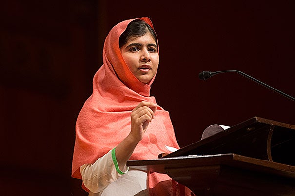 “A war can never be ended by a war. You can only fight wars with education," said Malala Yousafzai (photo 1), who received the Peter J. Gomes Humanitarian Award, presented by the Harvard Foundation and its director, S. Allen Counter (photo 2). Harvard Medical School Dean Jeffrey Flier (right) recognized neurosurgeon M. Junaid Khan with an award of appreciation for the pivotal role he played in Yousafzai’s care (photo 3).