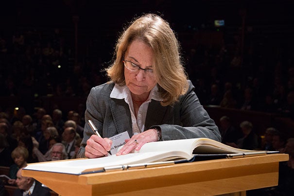 Xandra Owens Breakefield, a professor of neurology at Harvard Medical School, signs the American Academy of Arts and Sciences’ Book of Members, a tradition that dates back to 1780.