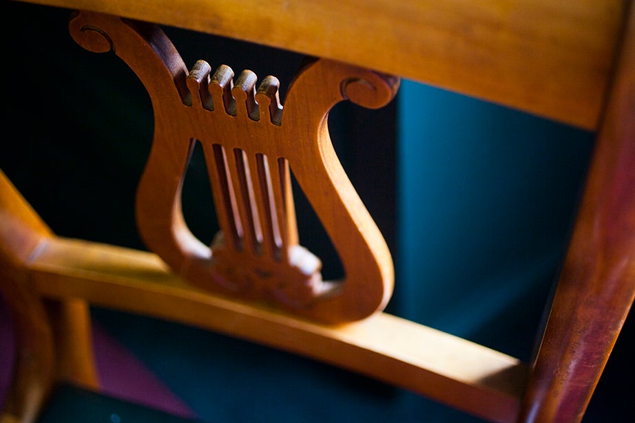 A carved lyre decorates the chairs inside the Loeb Music Library.