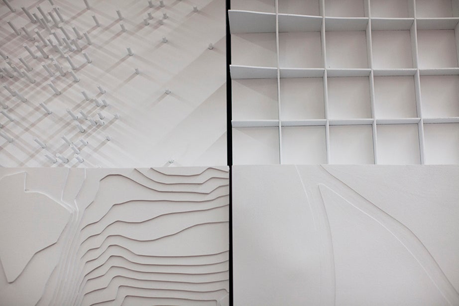 Four types of topographic maps are on display in the “Cartographic Grounds” exhibit at the Graduate School of Design.
