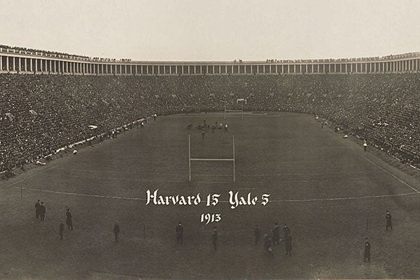 A detail from a panoramic photograph taken at the 1913 Harvard-Yale game at Harvard Stadium. The stadium was full to capacity with some spectators standing on the roof over the bleachers. Harvard won, as noted on the photograph, 15 to 5.
