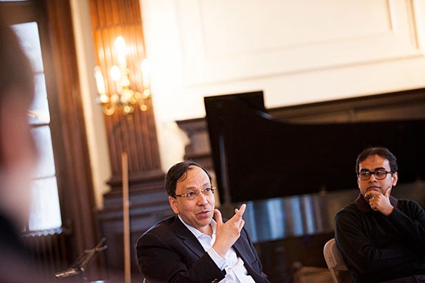 Sugata Bose (left) discussed a new composition inspired by the Ganges River with Sandeep Das (photo 1). During the Silk Road Ensemble's three-day residency at Harvard, Bose offered suggestions to Japanese flutist Kojiro Umezaki (photo 2). “We are trying as an organization to go just beyond the Silk Road trade route and think about it more as just a metaphor,” said violinist and composer Colin Jacobsen (photo 3).  



